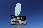 Milos Taxi Sign at Airport